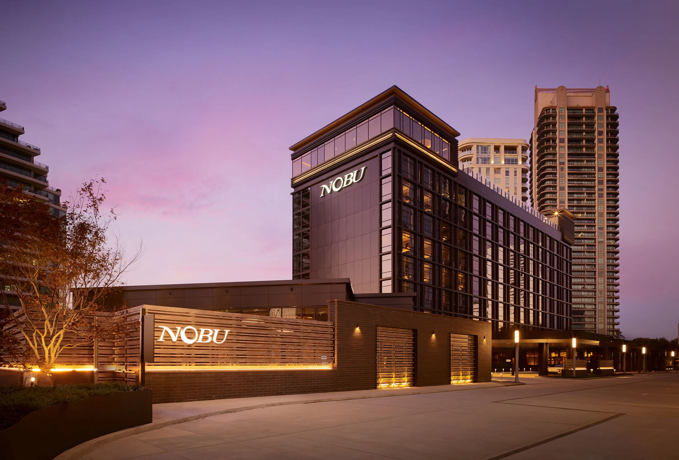 front of nobu hotel in atlanta with sign